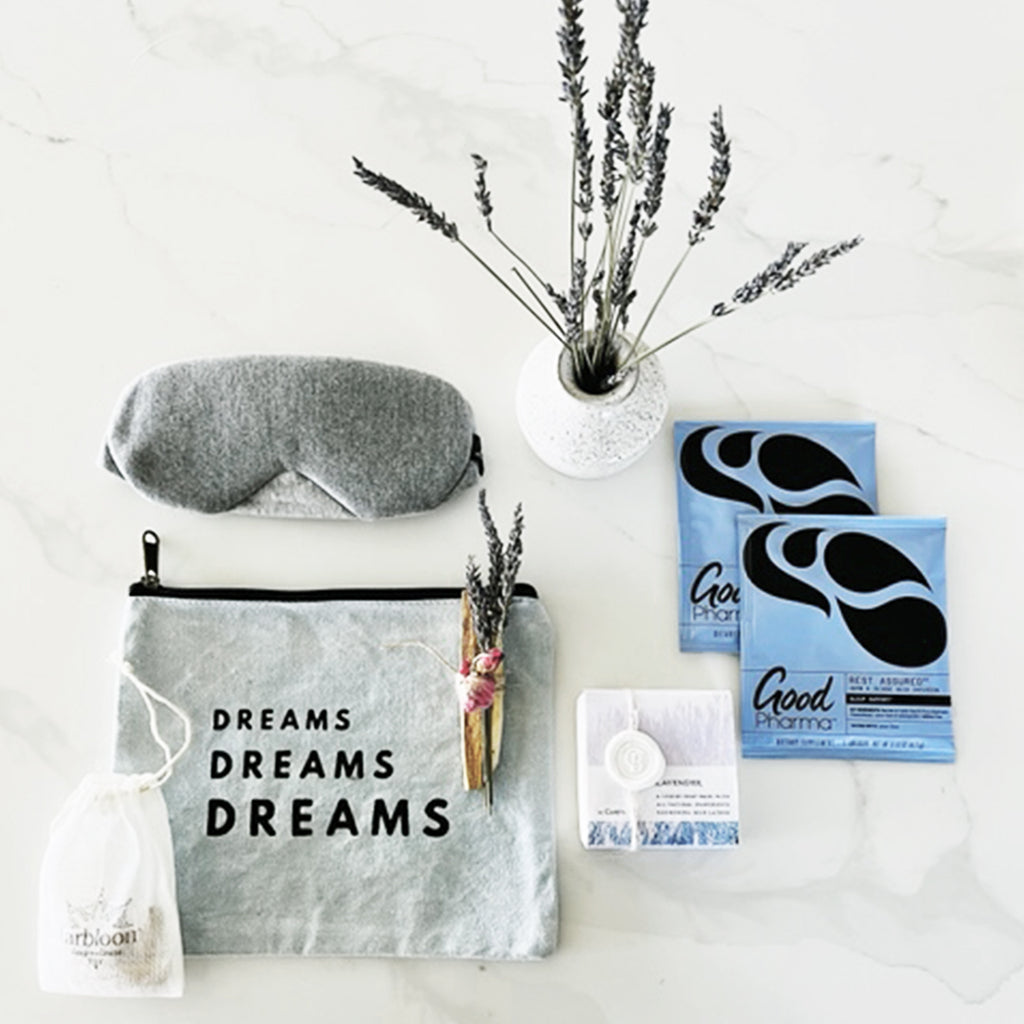 gift set filled with natural products to promote a good night's sleep.  gift box includes the perfect eye mask, ear plugs, sleep tea, lavender soap, lavender bundle and ceramic bud vase, and a sustainably sourced palo santo bundle